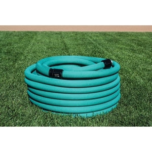 A coiled, green garden hose laid out on a grassy surface.

